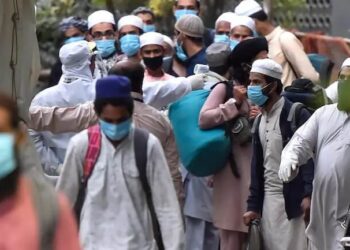 Members of Tablighi Jamaat outside the Nizamuddin Markaz building in March 2020. (PTI)
